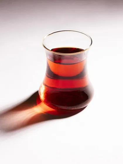 Another shot from the Turkish tea series, this time using the traditional curved glass to create a different shadow and highlight the deep red color of the tea.