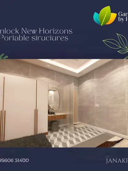 A render of a portable structure's interior, designed as a modern and elegant bedroom and dressing area. The space features a clean white wardrobe, a sleek vanity, and sophisticated marble-textured walls.