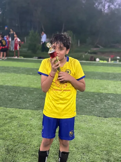 Kissing the trophy. A classic celebration from one of our players, showing his love for the game and for winning.