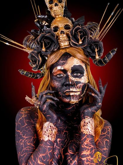 We witch you a Happy Halloween. This look is a deep dive into creative and SFX makeup, featuring body paint, gold leaf, and a custom-made skull headpiece.