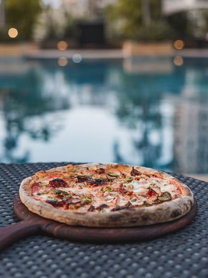 Pizza by the pool? Absolutely. Our mobile catering setup is versatile enough to bring the wood-fired experience to any location, turning your poolside party into a gourmet event.