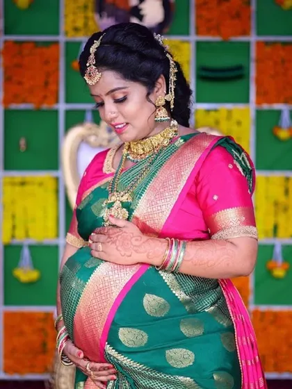 Celebrating a new chapter. This beautiful mom-to-be is glowing at her baby shower in one of our traditional gold-finish temple jewellery sets. Our collection isn't just for weddings; we love helping you find the perfect pieces for every milestone.