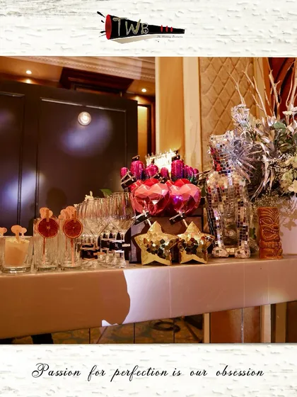 A stylish bar setup for a Sangeet, featuring unique star-shaped and heart-shaped glassware.