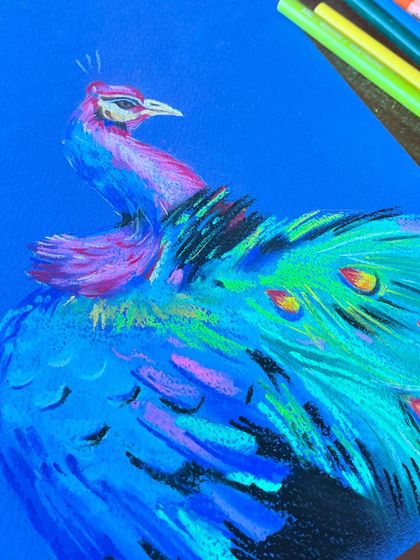 Adding the detailed plumage. The bright yellows and oranges of the peacock's tail feathers are added, bringing the entire piece to life with vibrant color.