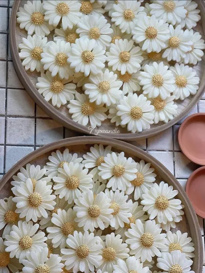 My earth pot daisy candles before being placed in their terracotta pots. The detail on each flower is crafted by hand.