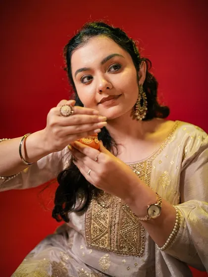 A beautiful portrait from a Diwali-themed shoot. Our colored backdrops and lighting can evoke the perfect festive mood.