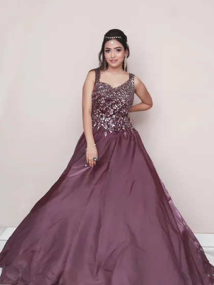 A full-length shot showcasing the entire gown. This gives a complete view of the outfit and is an essential part of any glamour or fashion-style photoshoot.