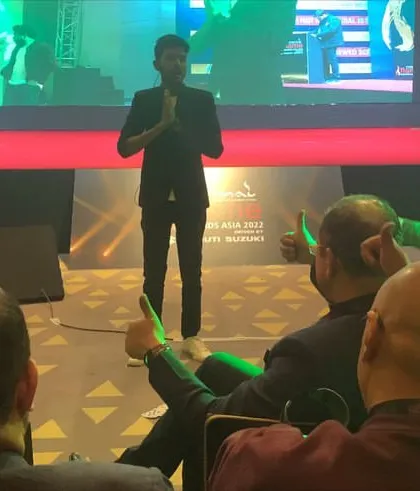 Taking a moment to connect with the audience after a stage illusion. The reactions and applause from a full house at a corporate gala are what make these large-scale shows so special.