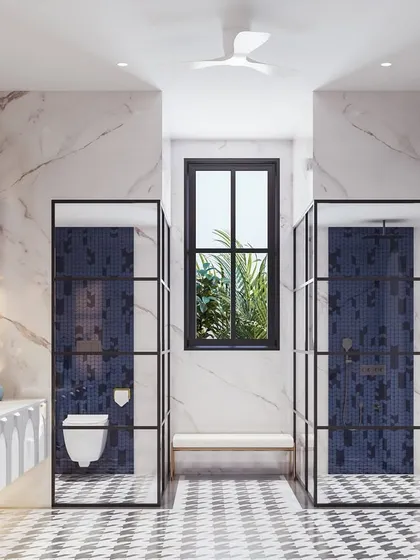 This symmetrical view shows how the space is organized, with twin shower and toilet cubicles framed in black metal and glass. The pop of blue from the mosaic tiles adds a vibrant touch.