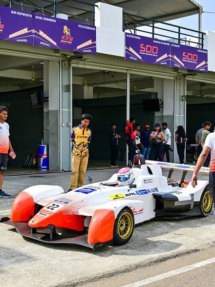 A race car in the pit lane at the Indian Racing Festival. We manage the entire event infrastructure, including the pit and paddock areas for the teams.