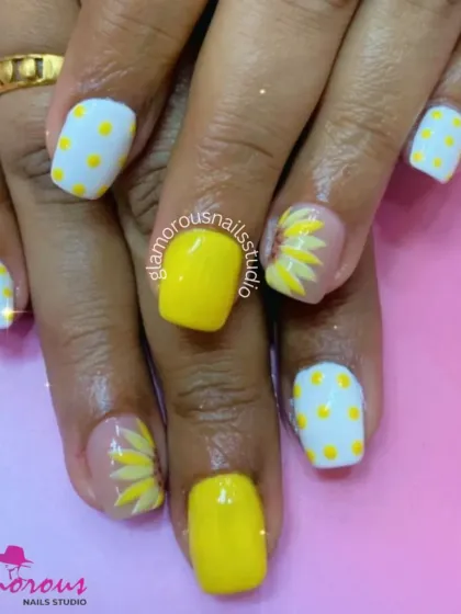 A sunny and cheerful design perfect for summer, featuring solid yellow nails, yellow polka dots, and hand-painted sunflowers.