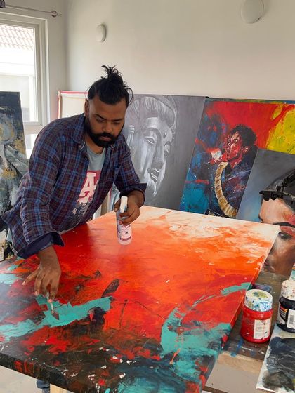 Another shot from the studio, applying spray to the canvas to manipulate the acrylic paint for 'The Uprising'. I'm always experimenting with new techniques.