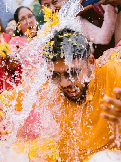 This is what we mean by capturing real moments. The sheer fun and chaos of a Haldi ceremony, frozen in a splash of water and a burst of laughter. This photo shows our candid approach and our love for the unscripted, joyful traditions that make Indian weddings so vibrant.