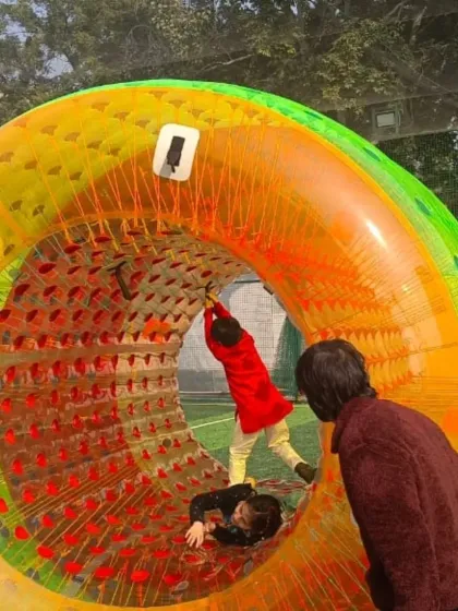 This giant inflatable roller wheel is a unique and exciting activity for kids. They can climb inside and work together to roll it across the grass, which is always a source of great laughter.