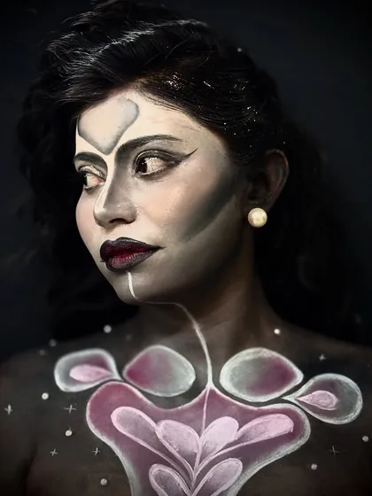 An abstract creative look with body paint, demonstrating the use of color, shape, and negative space to create a piece of living art.