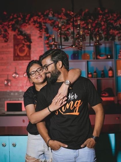 Another angle of the playful piggyback ride in the kitchen.