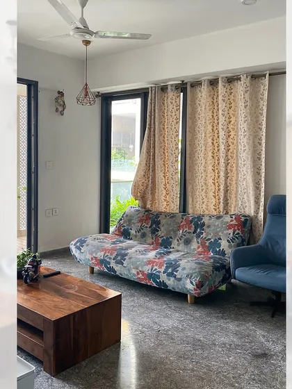 This was the space before we transformed it. It was a simple living area, and my job was to turn it into a dedicated, elegant dining room by providing the right furniture.
