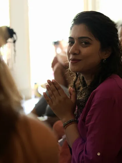 A candid moment of connection and gratitude during a kirtan session in Mysore. The joy of sharing this devotional practice with a community of seekers is a beautiful expression of oneness.