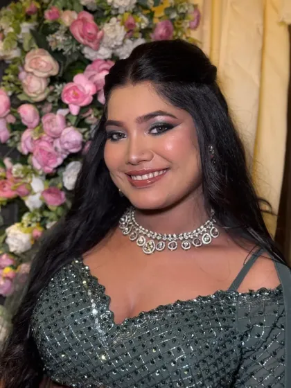 A happy and glamorous shot. The dramatic eye makeup is paired with a big smile, showing that you can have a bold look and still feel comfortable and joyful.