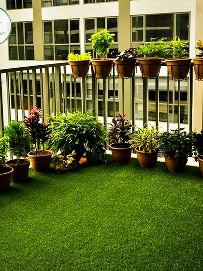 You don't need a huge space to have your own green corner. I turned this Noida apartment balcony into a lush mini-garden using high-quality artificial grass and a curated selection of potted plants that thrive in balcony conditions.