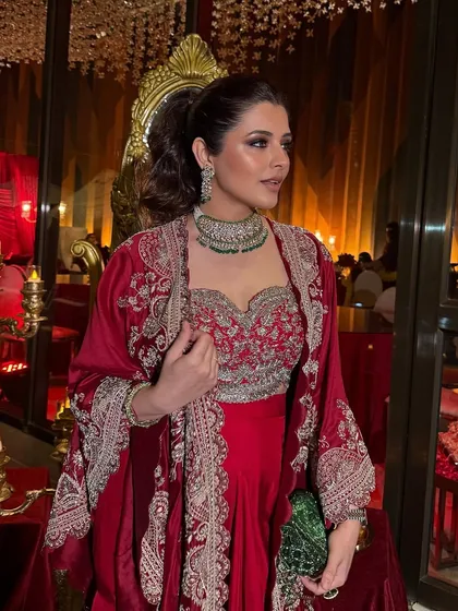 A close-up of the Sufi night glam. The rich colors of her outfit are complemented by warm, bronzed makeup and a defined eye, creating a look of pure opulence.