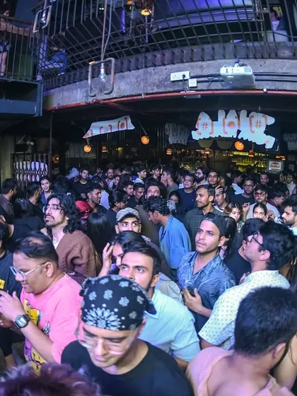 A wide view of the crowd looking up at the stage, fully engaged.