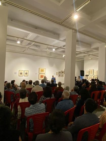 A view from the back of the audience at the artist talk.