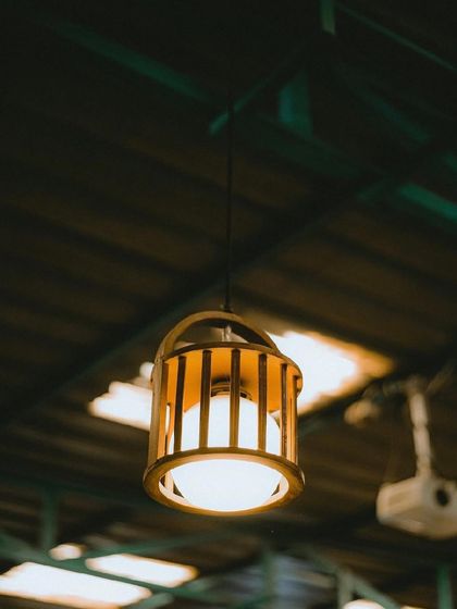 A close-up of our rustic and warm light fixtures that add to the cozy ambiance of the cafe.