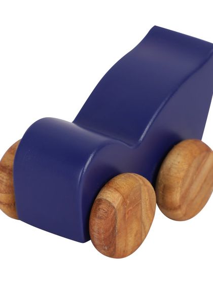 A side profile of a blue wooden bird-shaped toy car.