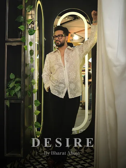 Transparency with intention. This shot captures the bold and confident spirit of the sheer floral embroidered shirt.