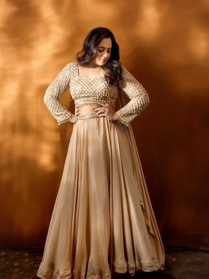 A confident pose from Spruha Varad, showcasing the full effect of her Filmfare red carpet attire.