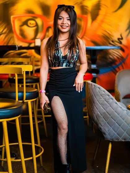 A stylish guest posing at the bar.
