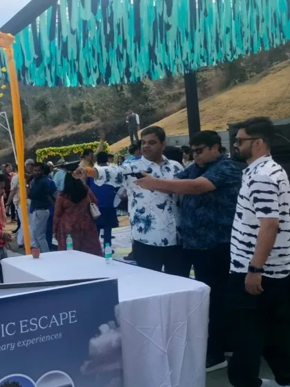 Guests taking aim at the balloon shooting stall during a Haldi function. My carnival games are a perfect icebreaker and add a unique element to wedding festivities.