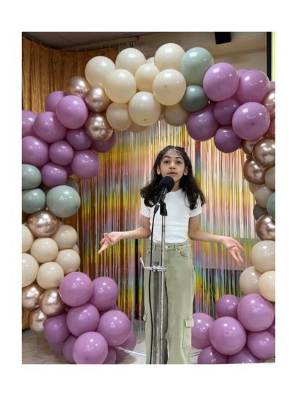 This performer confidently delivers her stand-up routine, proving that comedy is a fantastic tool for building public speaking skills.