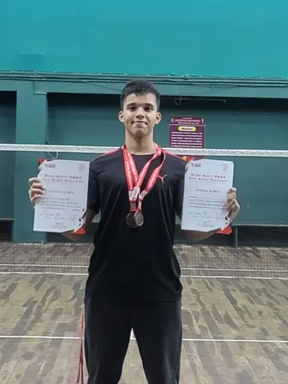 Vikrant proudly displays his two certificates of merit for winning bronze in both the Boys U16 Individual and Team Championship events.