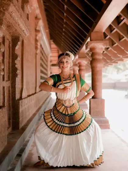 A duplicate of image 62, this shot captures a dancer in mid-pose, showcasing the dynamic movement and expressive nature of Mohiniyattam.