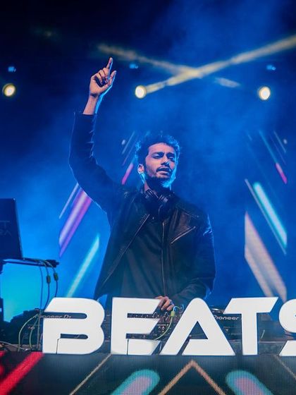 Standing behind my custom "BEATS" console at the JNC festival. Branding and visuals are key.