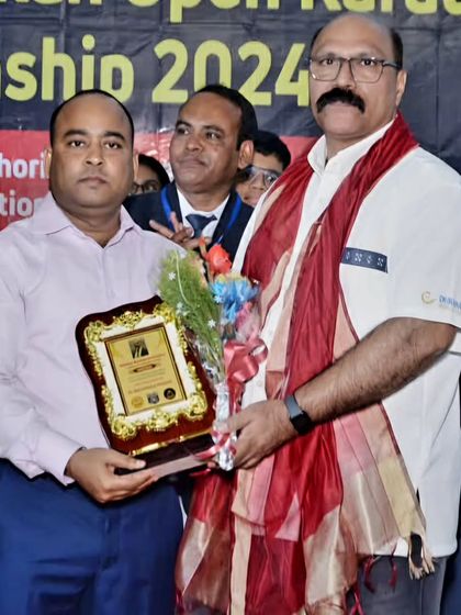 Receiving an award at the 13th National Karate Championship organized by our West Bengal branch. It was a proud moment for our entire federation.