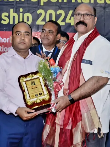 Receiving an award at the 13th National Karate Championship hosted by our West Bengal branch. Our federation has a strong presence across India.