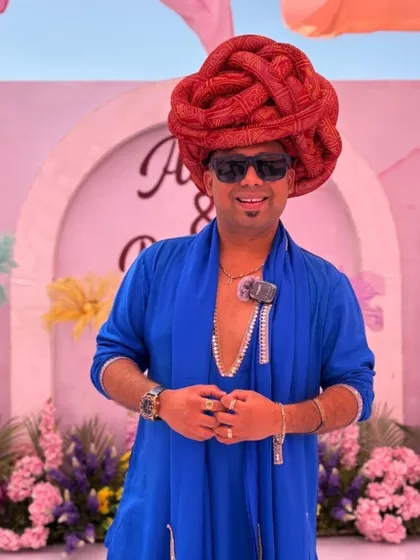 Dressed in a vibrant blue kurta and a traditional turban for a daytime wedding event. I adapt my style and energy to suit the specific function I am hosting.