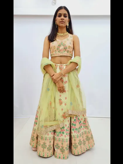 A duplicate of 228, a full view of the pastel green lehenga.