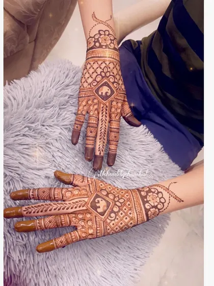 A modern take on a traditional design, with a central elephant motif inside a geometric pattern.