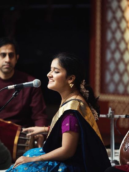 A side profile shot from my Narada Gana Sabha concert, showing my interaction with the tambura artist. The constant drone of the tambura is the foundation upon which all Carnatic music is built.