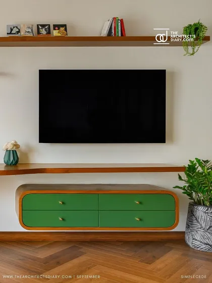 A unique floating TV console with curved green drawers, designed for the master bedroom in the 'Cover me in Sunshine' project.