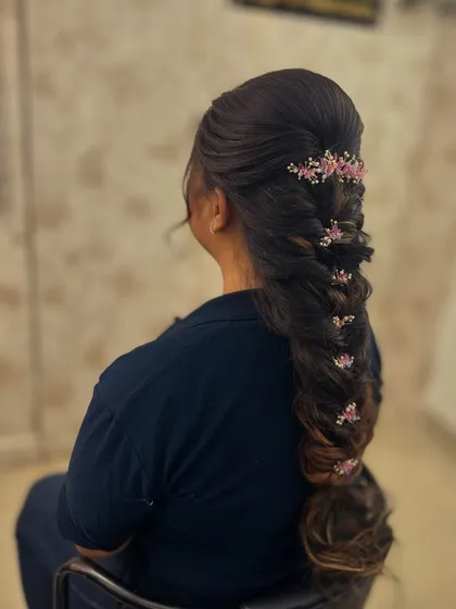 A three-quarter view of the intricate fishtail braid, perfect for a sangeet or mehendi look.