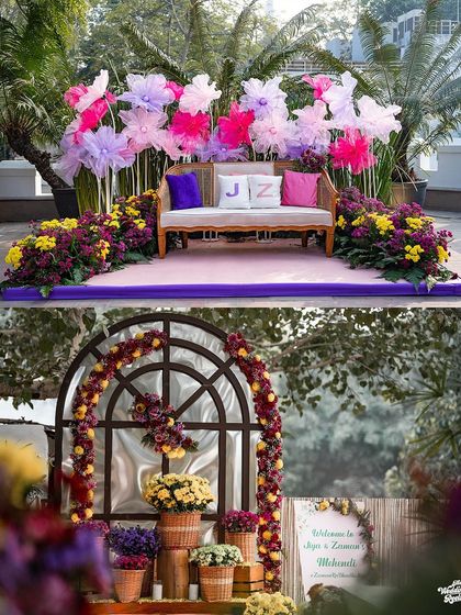 A snapshot of the beautiful and colorful decor from a Mehendi ceremony, featuring floral arrangements and personalized cushions.