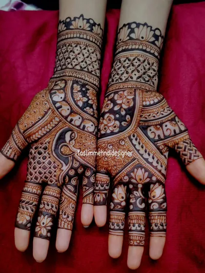 This is the kind of rich, detailed mehndi I love to create. The design is packed with traditional Indian motifs like peacocks and lotuses, with fine lines and a beautiful dark stain that shows the quality of my natural henna paste.