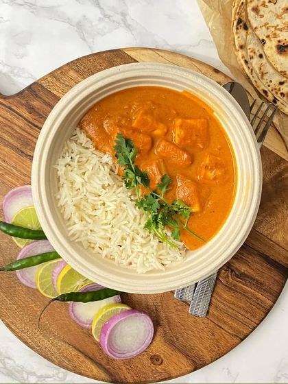 This is one of my popular meal bowls, featuring Kadhai Paneer with Jeera Rice and a side of Tandoori Roti. It's a perfect single-serving option for lunches or more casual events.