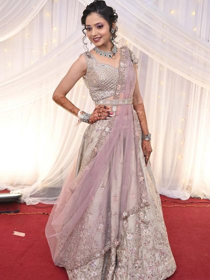 Another angle of the client in the same lehenga, highlighting the detailed work.