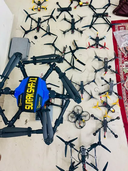 This is my drone arsenal. It shows the variety of FPV and custom drones we build and fly, from small cinematic whoops to large custom-built hexacopters like the Suraksha-X1.
